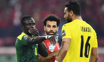 Senegal’s Sadio Mané speaks with Egypt’s Mohamed Salah and Abou Gabal before his first-half penalty was saved.