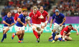 Aaron Wainwright (center) breaks away to score a first-half try for Wales.