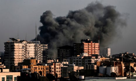 Smoke billows from a targeted neighbourhood in Gaza City during an Israeli airstrike on Sunday.