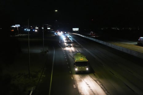 A convoy of buses moves along Interstate Highway 10 after leaving the Marine Corps base in Twentynine Palms, Calif, Monday, 9 June 2025, near Redlands, Calif.