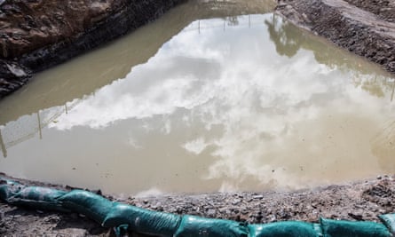 Runoff water sits in a makeshift pond at the development site of The Forest high school, Manly Vale.