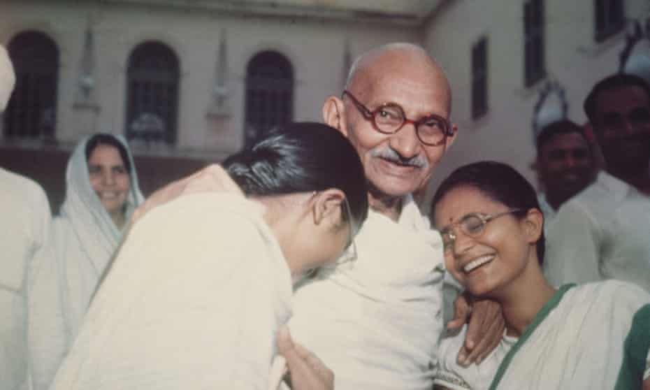 Mahatma Gandhi with Abha and Manu.