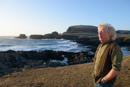 Dave Brackenbury on Fair Isle with seascape in the background