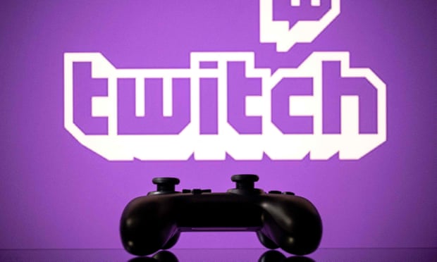 A gamepad is pictured as a screen displays the online Twitch logo