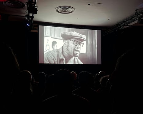 A film plays on a screen