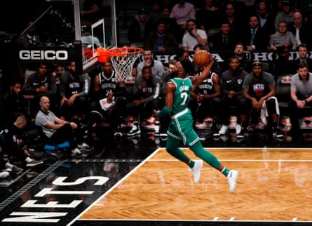 Jaylen Brown dunks during a game against the Brooklyn Nets