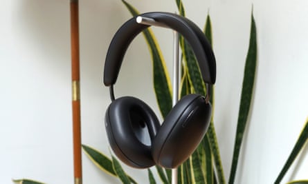 The Sonos Ace headphones hanging from a stand