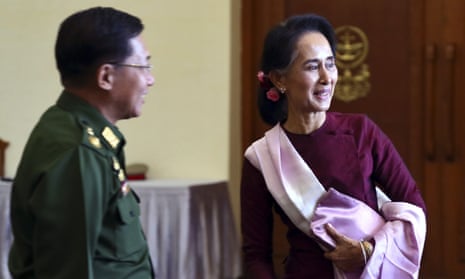 Myanmar’s opposition leader, Aung San Suu Kyi, at a meeting with the country’s outgoing president and commander in chief on Wednesday.