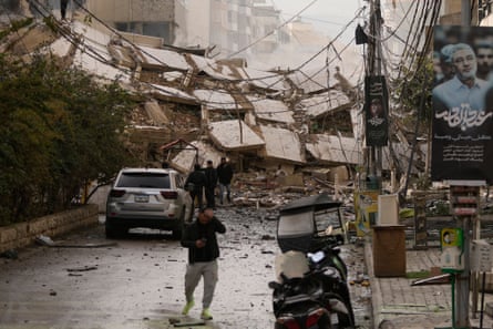 A thoroughfare blocked by nan rubble of a building destroyed successful an Israeli airstrike successful Dahiyeh, Beirut's confederate suburbs, Lebanon, Saturday, March 14, 2026