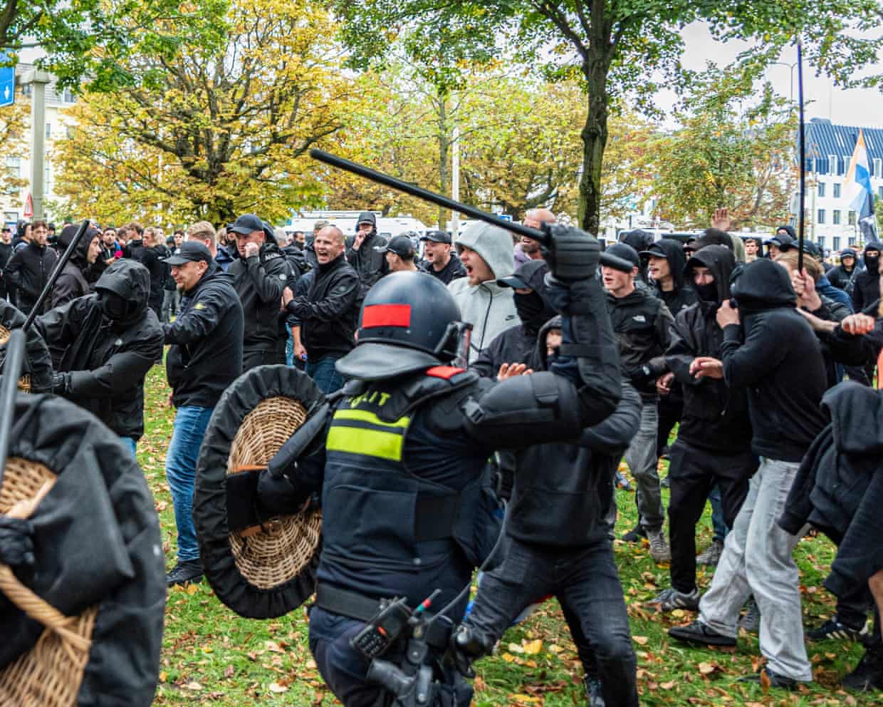 Demonstrators attack police