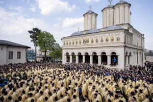 Romanian Orthodox priests outside the Patriarchal Cathedral after an Orthodox Palm Sunday pilgrimage in Bucharest