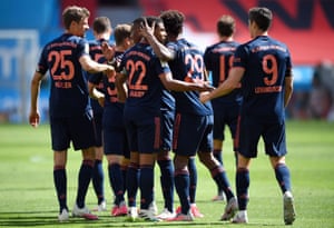 Bayern Munich’s Serge Gnabry (centre) is congratulated by his teammates after scoring their third goal.