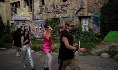 People make on their way to a daytime party in Kyiv