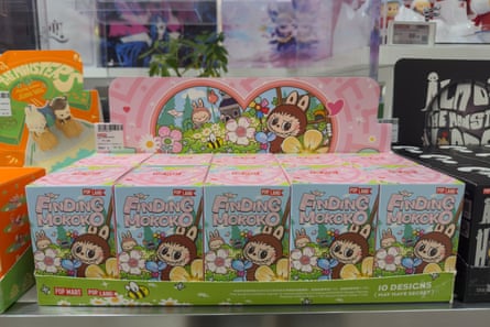 neatly arranged boxes of labubu figurines called “finding mokoko” on display in a store