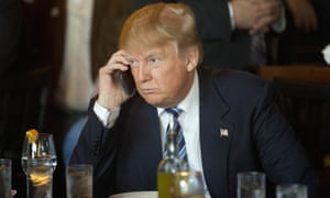 Donald Trump holding a mobile phone to his ear