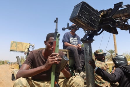 Members of the Sudanese armed forces sit on an army vehicle in Omdurman, Sudan, 9 March 2024.