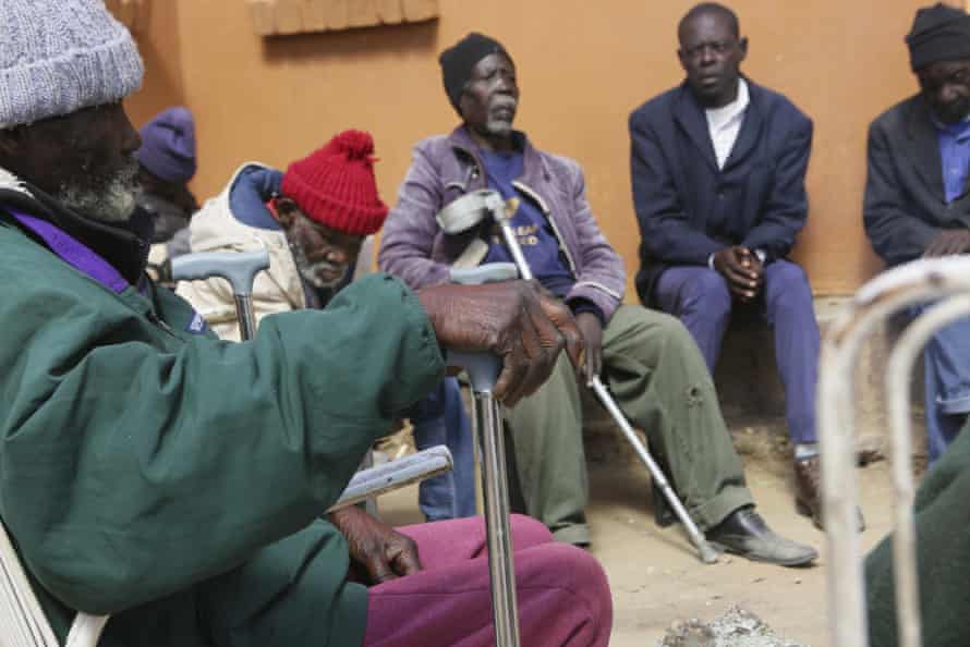 Residents wait to be served a meal at Melfort Old People’s home on the outskirts of Harare, Zimbabwe.