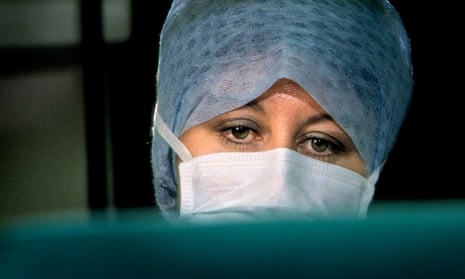Theatre nurse wearing a surgical mask