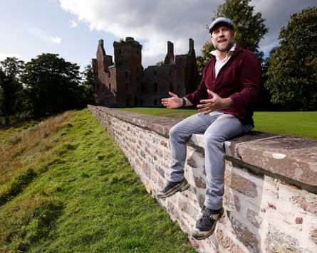 Corey Kinnan in front of a Scottish ruin