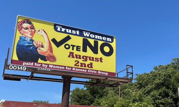 A billboard urges voters to vote no on a referendum that would spell the end to abortion rights in Kansas.