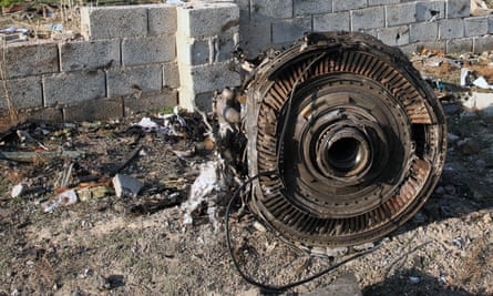 An engine lies on the ground after Wednesday’s plane crash.