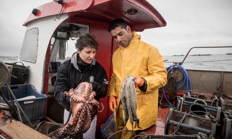 Chef Nieves Barragán Mohacho and fisherman Felix Piñeiro inspect the day’s catch.