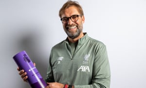 Jurgen Klopp poses with the Manager of the Month award for January.