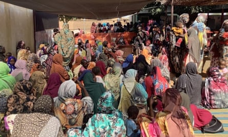 People waiting in a tent