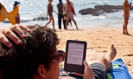A tourist in Goa reads an Amazon Kindle – the market leader in ebooks.