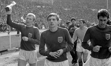 Martin Peters, second left, with Bobby Moore, left, Gordon Banks and Geoff Hurst, right, parading the World Cup around Wembley after England’s victory in 1966.