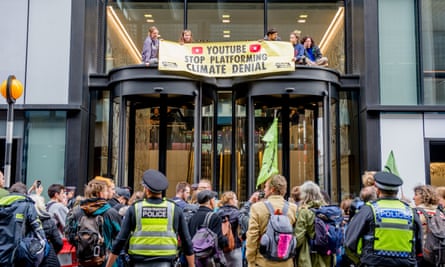 Members of XR Youth protest in front of YouTube offices in central London.
