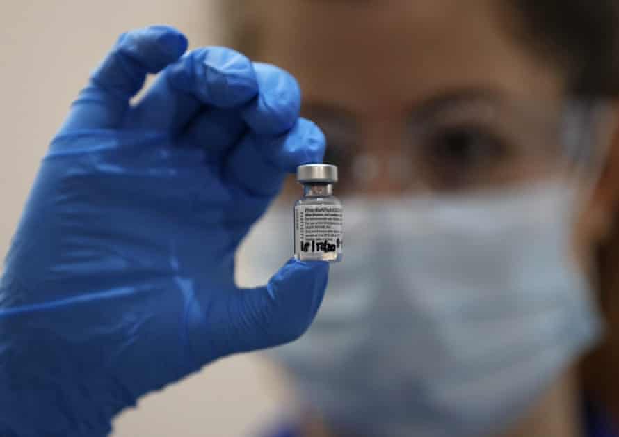 A nurse in London holds a phial of the Pfizer-BioNTech Covid-19 vaccine.