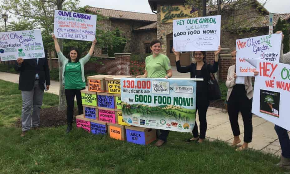 Protesters gather at an Olive Garden in Hyattsville, Maryland, on Thursday as part of a national campaign to force the restaurant chain to change its meat purchasing and labor practices.