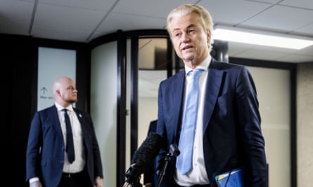 Geert Wilders leaves a meeting in The Hague, 5 March 2024: he is a tall, blond-haired 60-year-old man and wears a dark blue suit, white shirt and pale blue tie.