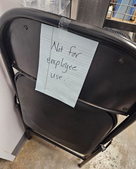 Chair with handwritten note on it saying ‘not for employee use’