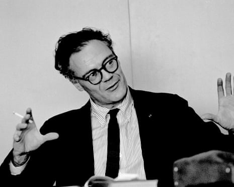 Portrait Of Robert Lowell<br>Cigarette in hand, American poet and playwright Robert Lowell (1917 - 1977) gestures as he speaks from behind a table, Boston, Massachusetts, 1964. (Photo by Steve Schapiro/Corbis via Getty Images)