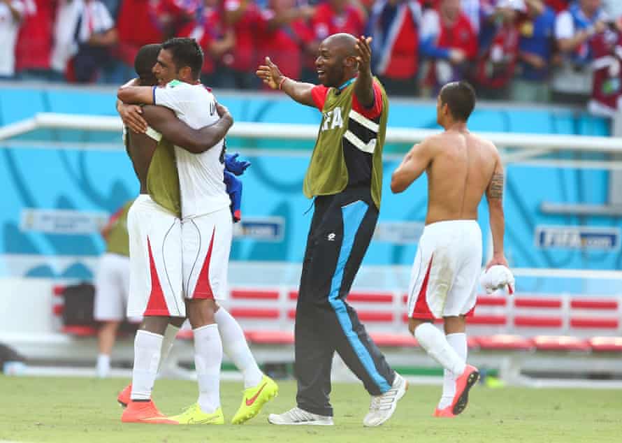 Paulo Wanchope celebrates with his players after Costa Rica defeated Italy at the 2014 World Cup