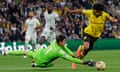 Borussia Dortmund's Karim Adeyemi goes past Real Madrid's goalkeeper Thibaut Courtois.