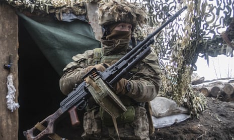 A Ukrainian soldier stands at the line of separation from pro-Russian rebels in the Donetsk region, Ukraine.