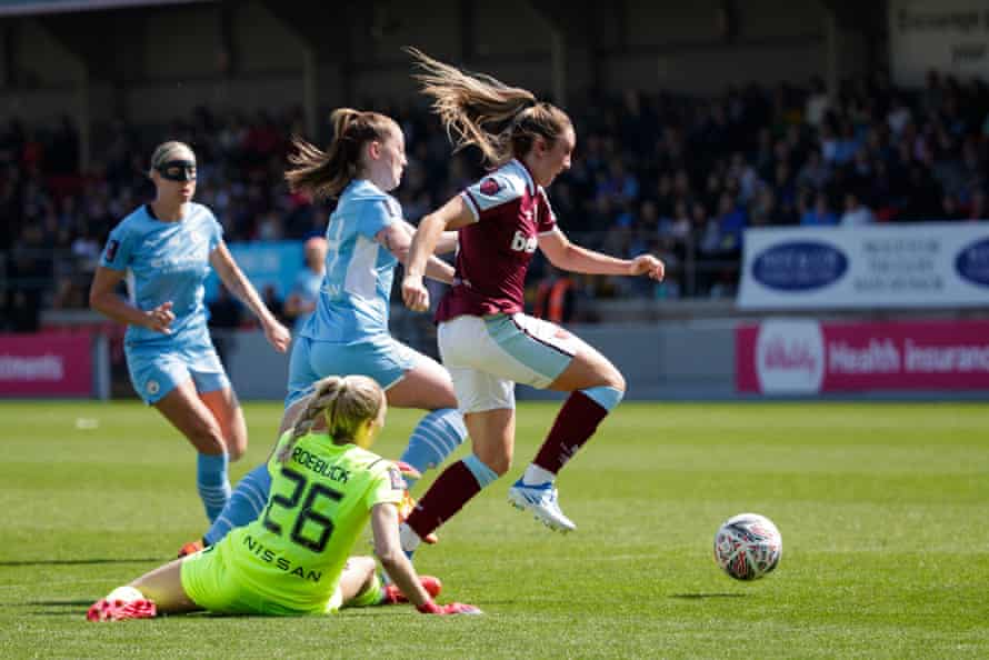 Lisa Evans goes through to score for the Hammers.