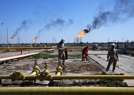 Basra Oil Company staff work at the Nahr Bin Umar oil and gas field in Basra