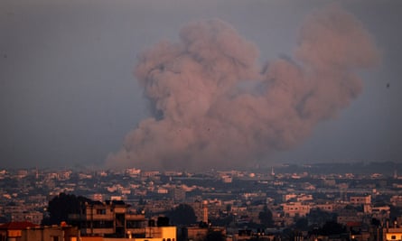 A picture taken from Rafah shows smoke billowing over Khan Yunis in the southern Gaza Strip during Israeli bombardment on 3 January 3 2024, amid ongoing battles between Israel and the Hamas movement.