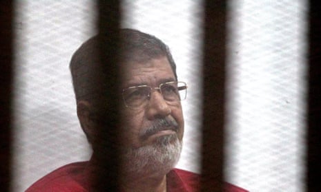 Deposed Egyptian president Mohamed Morsi during his trial on charges of espionage in Cairo.