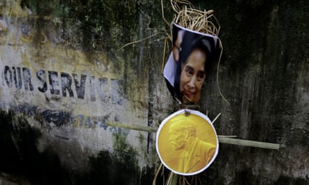 An effigy of Aung San Suu Kyi is placed against a wall during a protest in Kolkata, India