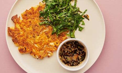 Meera Sodha’s kimchi pancakes with a salty-sour dipping sauce and spinach salad.