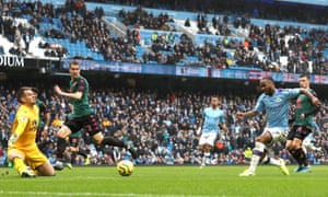 Raheem Sterling of Manchester City scores his team’s first goal.