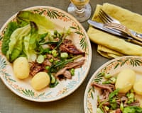 Conor Gadd's lamb shoulder cooked in buttermilk with peas and broad beans, on a plate.