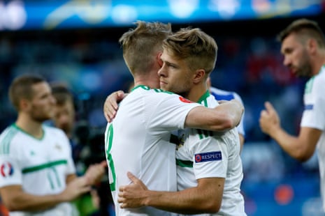 Northern Ireland’s Steven Davis and Jamie Ward, right, console each other at the end of the match.