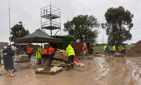 Volunteers fill sandbags at Forbes