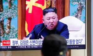 South Korean people watch a TV broadcasting a news report on North Korean leader Kim Jong-un in Seoul